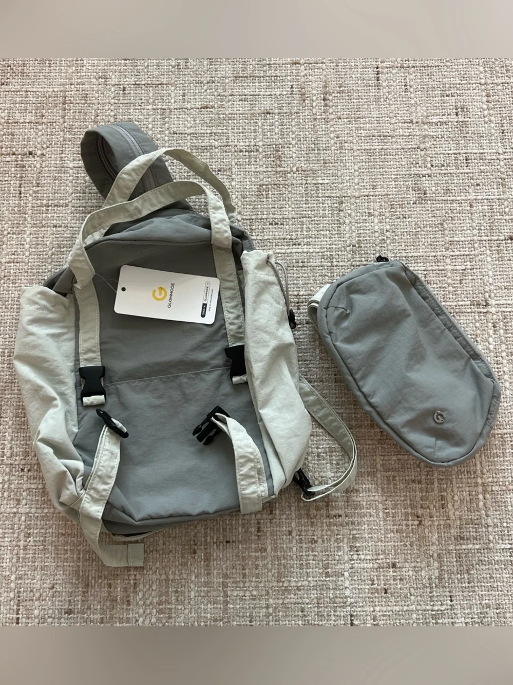 Glowmode gray backpack with detachable pouch and separate zip strap